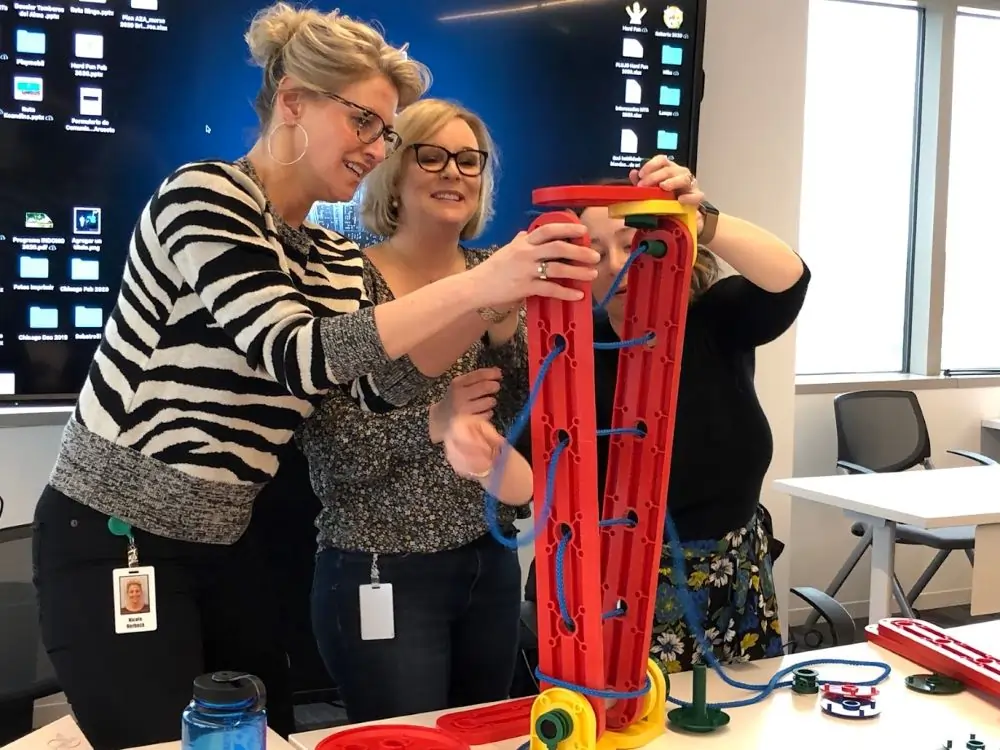 Participants engaged in a team-building activity, enhancing communication, trust, and collaboration.