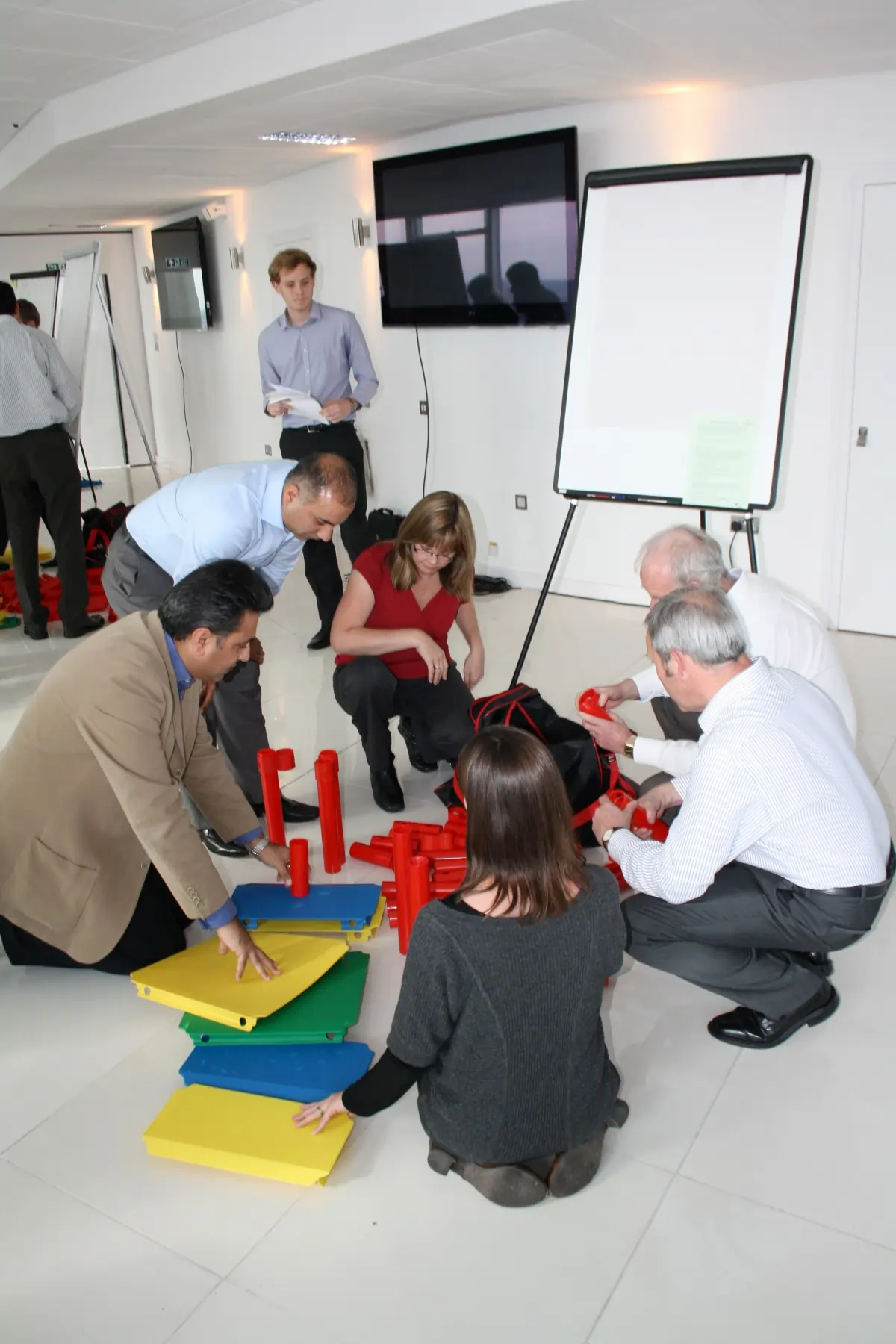 A group using the MTa Team Kit at a Masterclass, actively participating in group development exercises.
