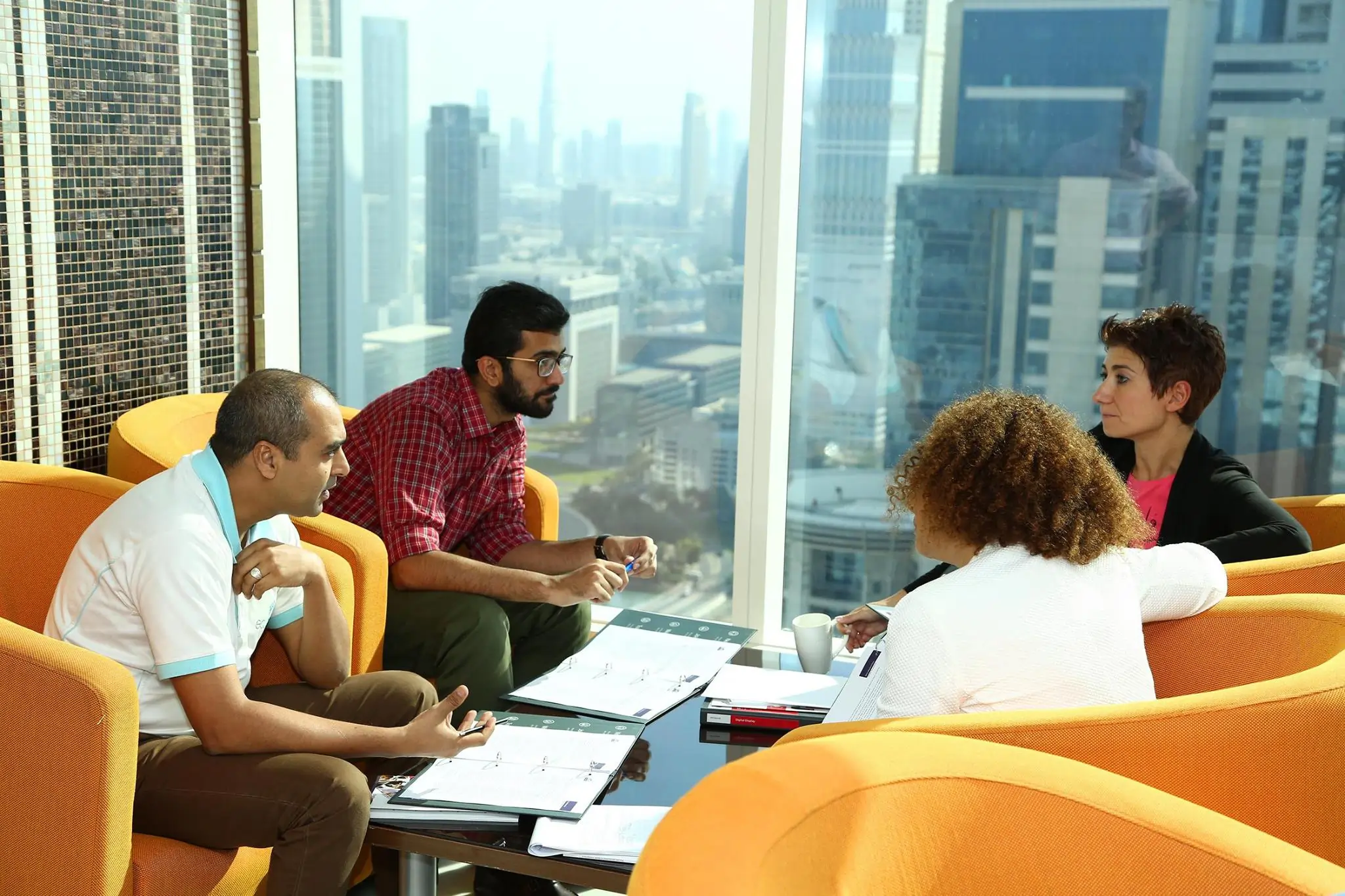 Participants in discussion during 'The Culprit' activity, focusing on feedback, teamwork, and leadership skills.