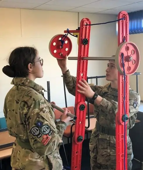 Cadets engaged in hands-on learning with MTa STEM kit, fostering teamwork and problem-solving skills.