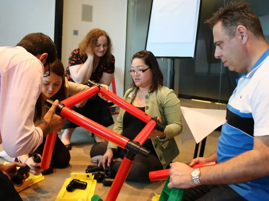 Masterclass participants collaborating with the MTa Team Kit, engaging in impactful team-building activities.