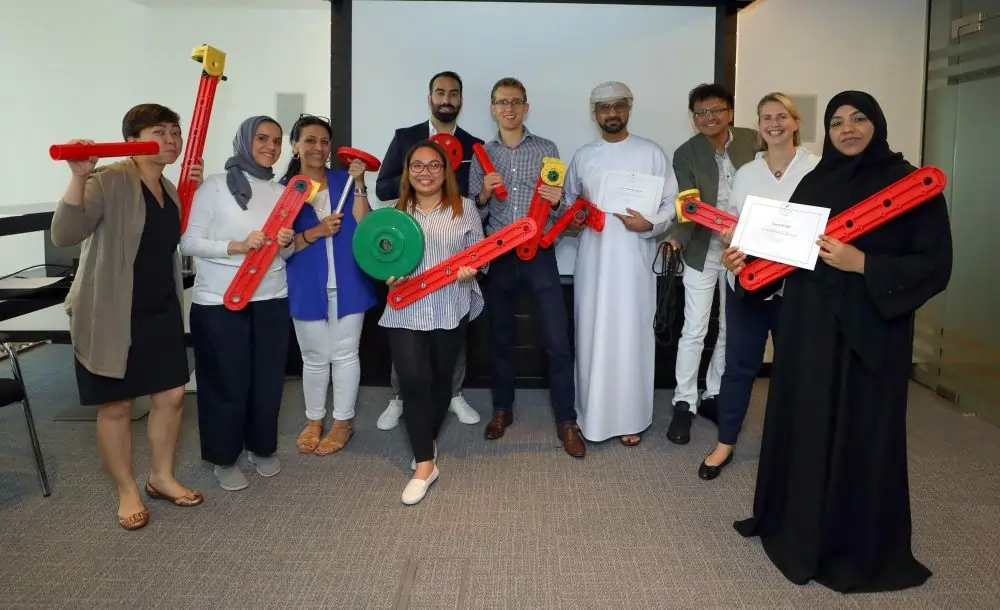 A group of people at an MTa Masterclass, engaging in activities to enhance their facilitation skills.