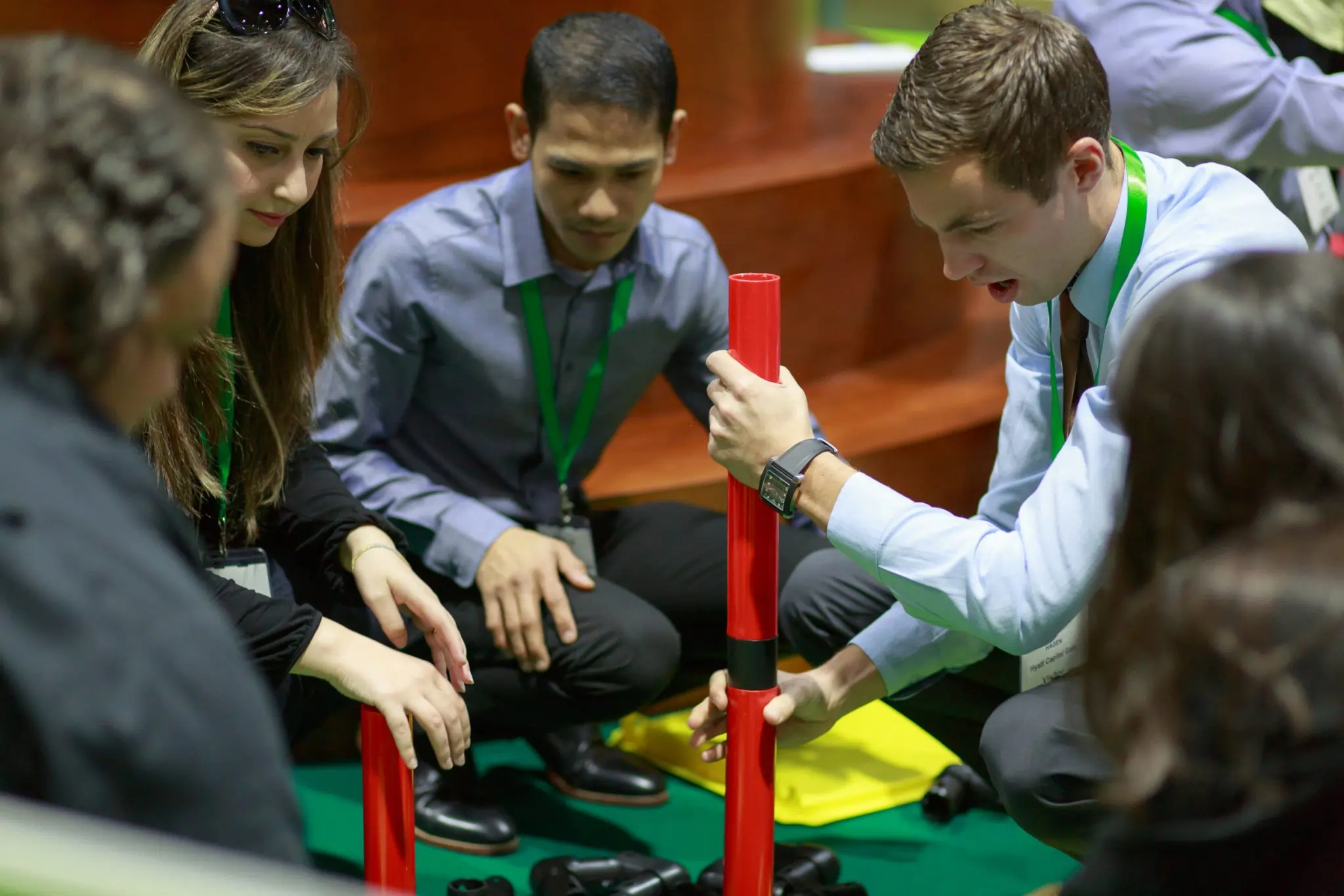 Conference participants engaging with the MTa Team Kit as an energiser, enhancing teamwork and focus.