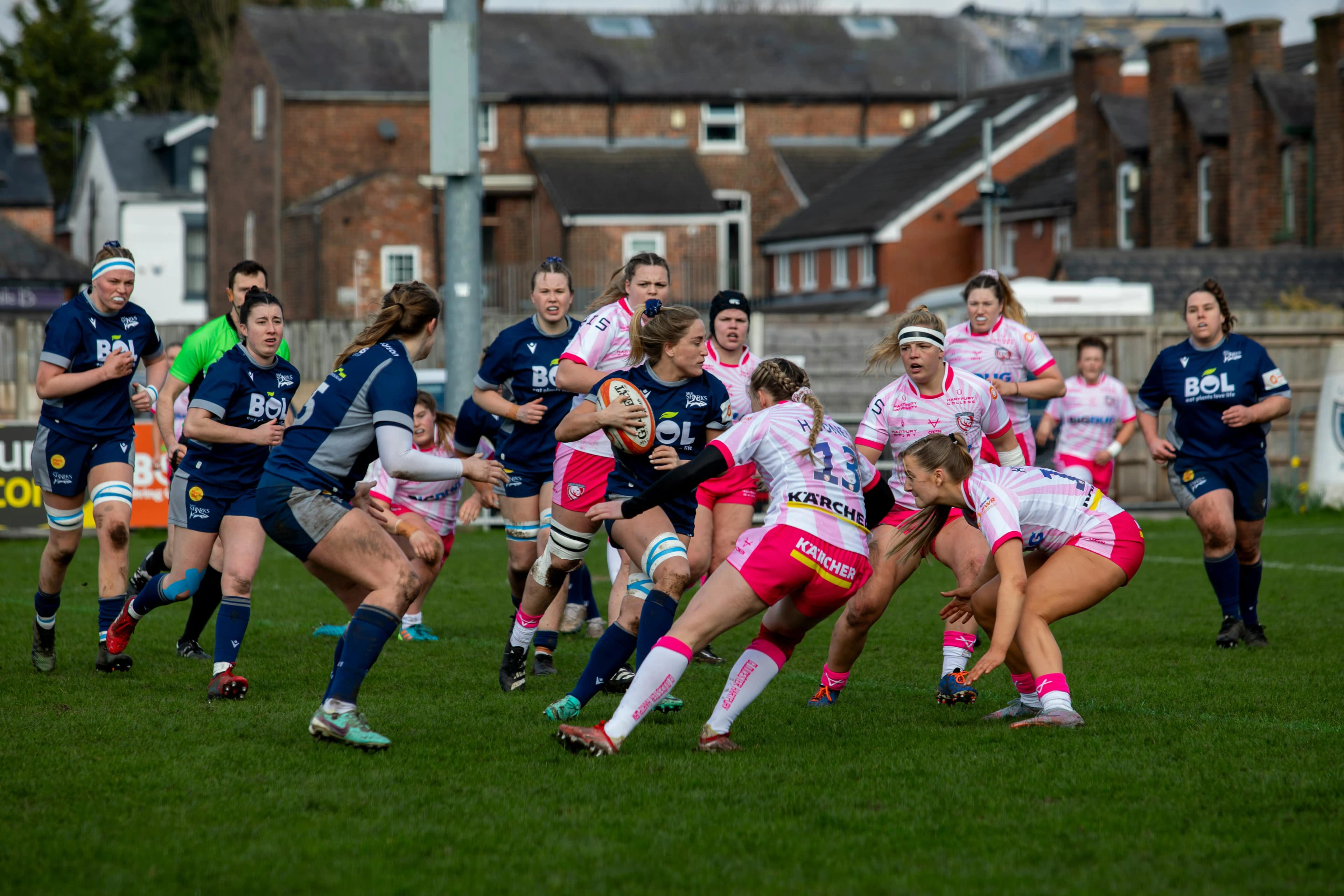 Rugby players running together, showcasing teamwork, strategy, and communication on the field.